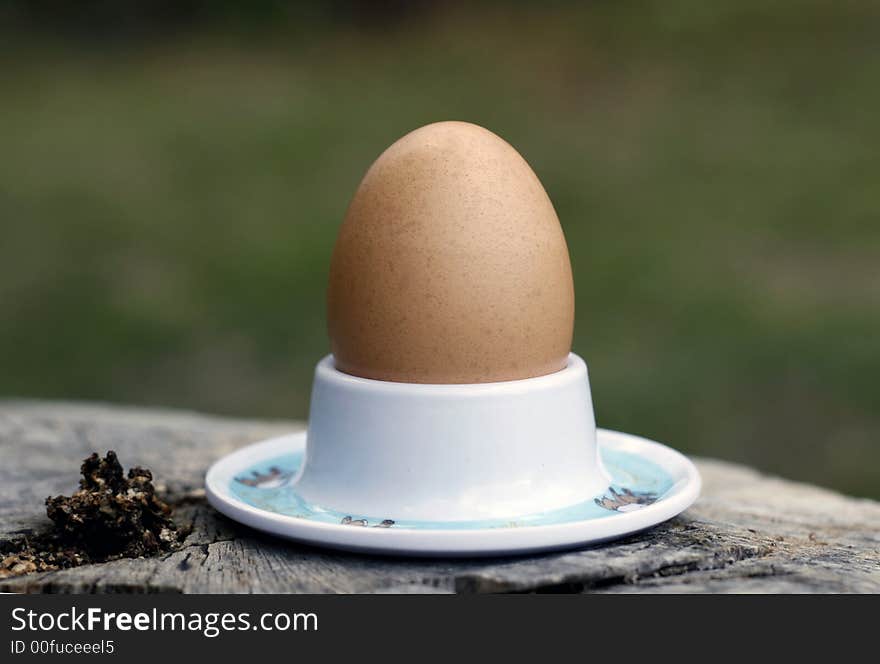 A soft boiled egg in an egg cup.