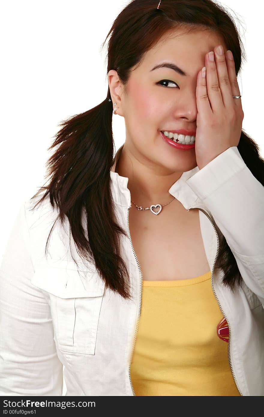 Pretty asian girl close her left eye and smiling. Pretty asian girl close her left eye and smiling