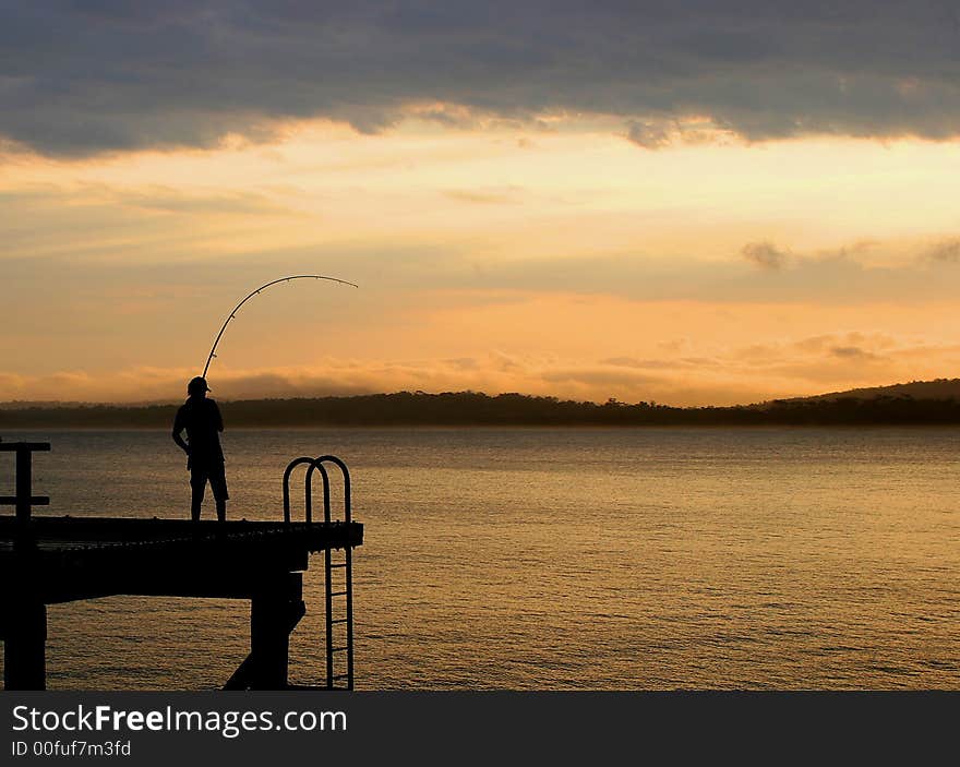 Fisherman on the Merimbula Wharf