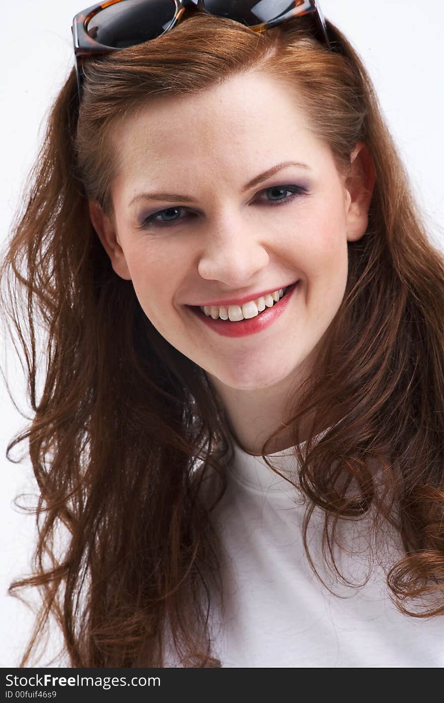 Portrait of a beautiful young woman smiling at the camera. Portrait of a beautiful young woman smiling at the camera