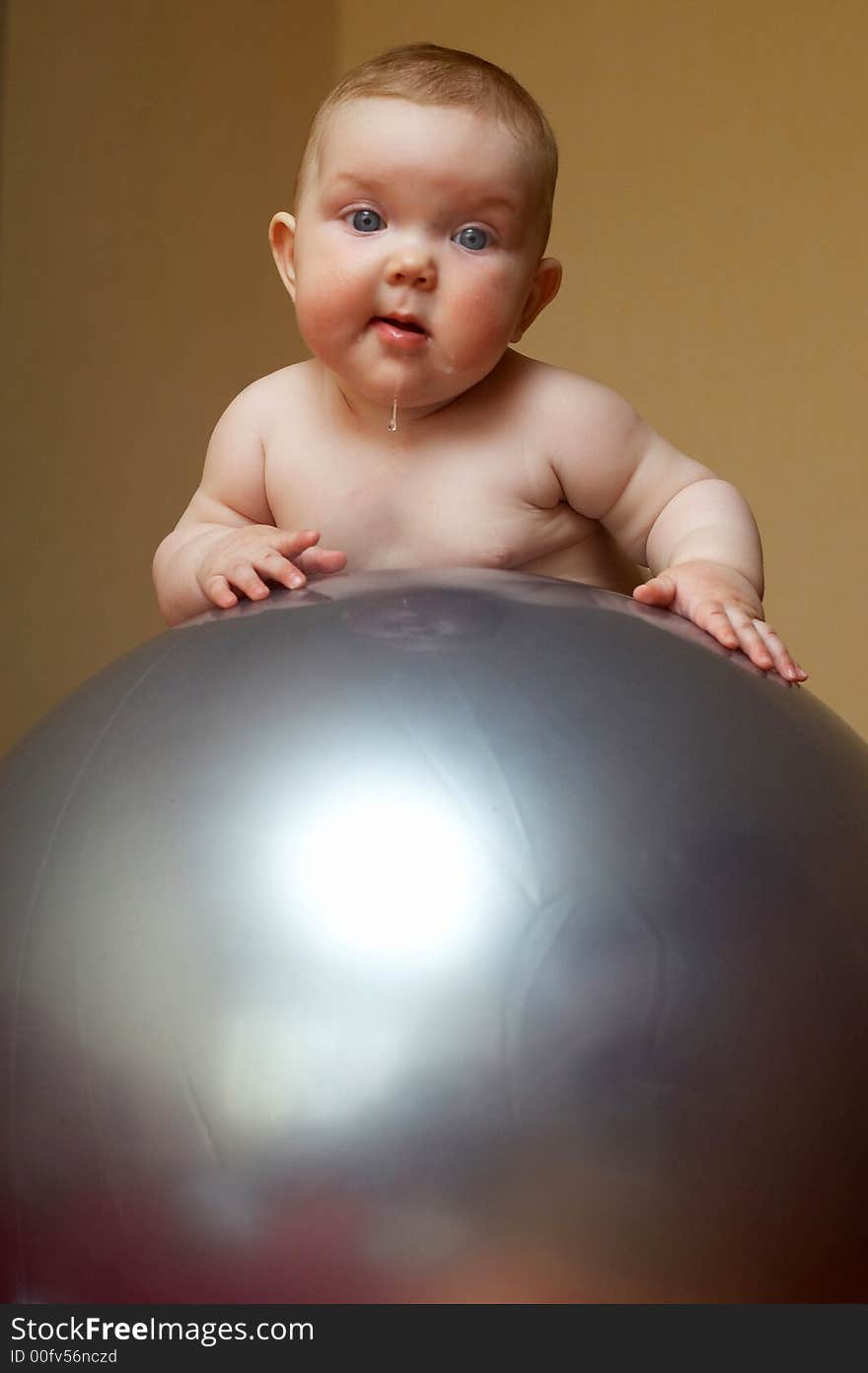 An image of a baby on the big ball. An image of a baby on the big ball