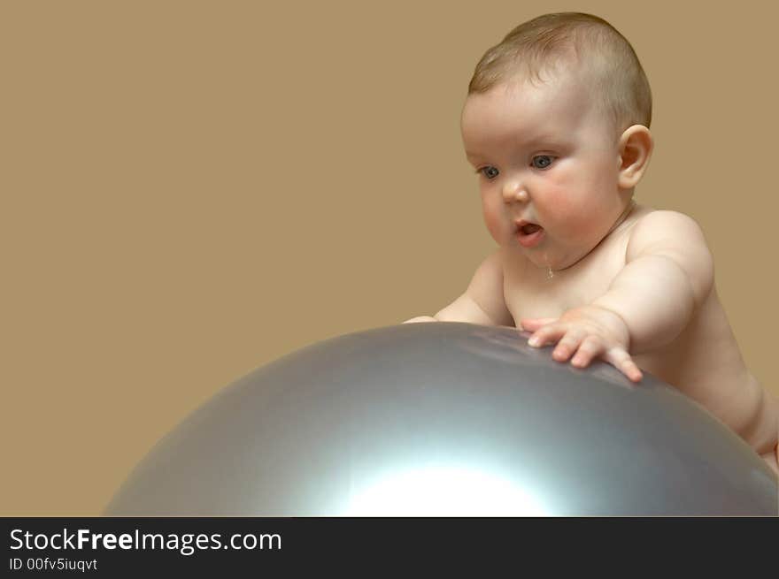 An image of a baby on the big ball. An image of a baby on the big ball