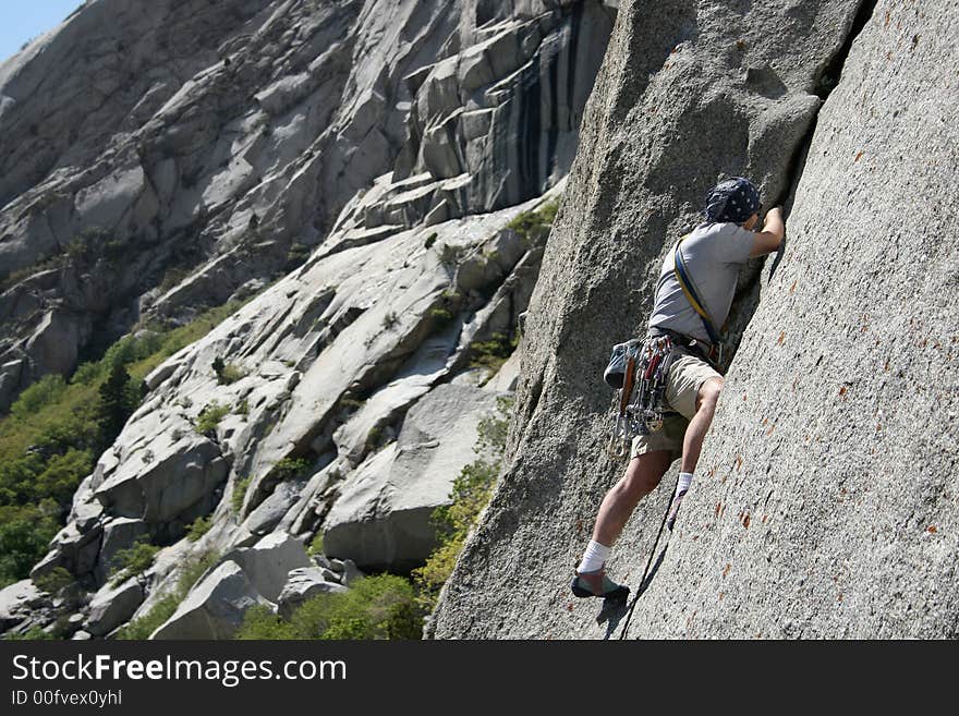 Rock climber placing gear