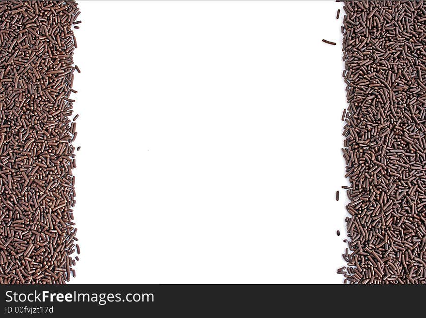 Chocolate sprinkles with white background and copyspace. Chocolate sprinkles with white background and copyspace