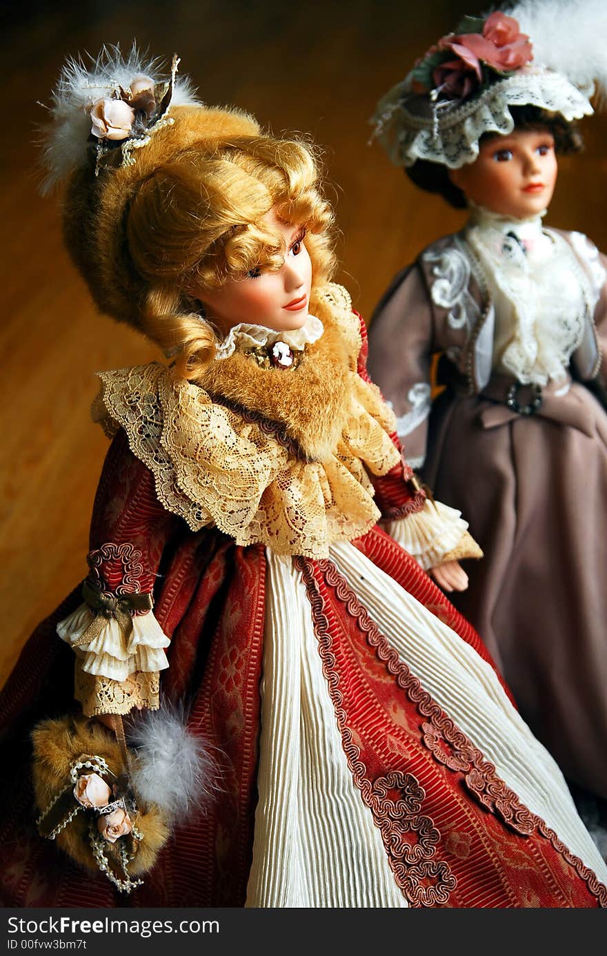 Two elegant lady porcelain dolls. Two elegant lady porcelain dolls