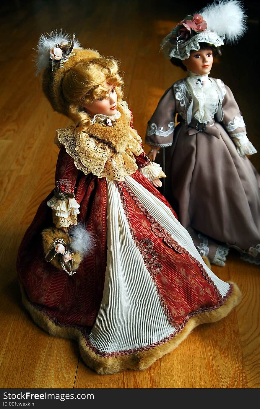 Two elegant lady porcelain dolls. Two elegant lady porcelain dolls