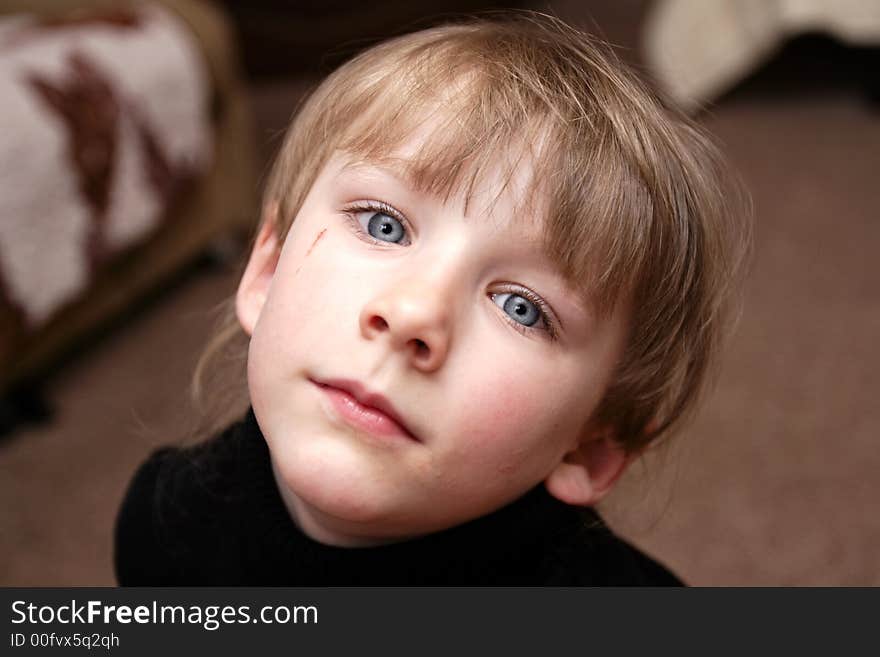 The girl with blue eyes poses at home. The girl with blue eyes poses at home