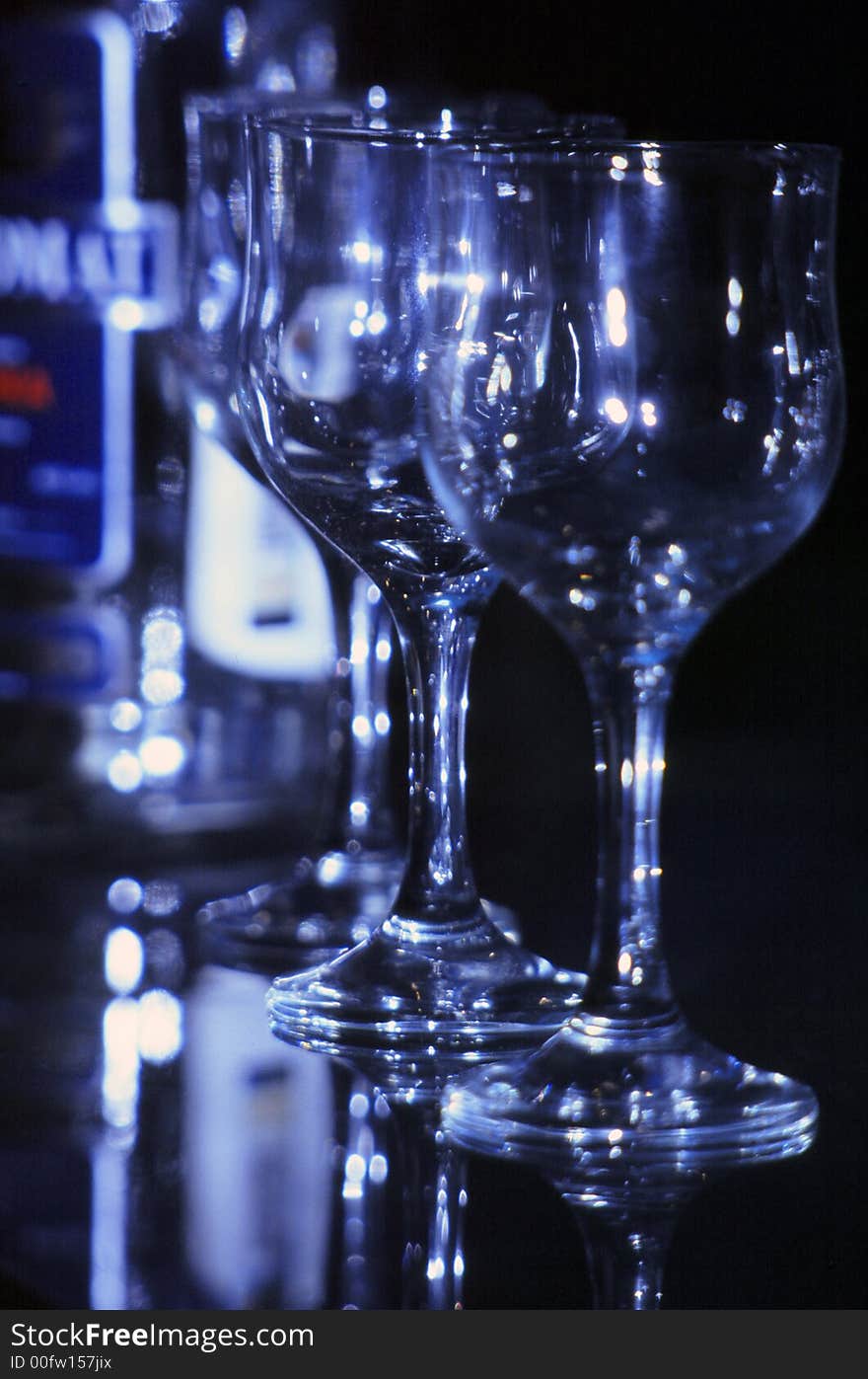 Blue glasses on the table with reflections. Blue glasses on the table with reflections