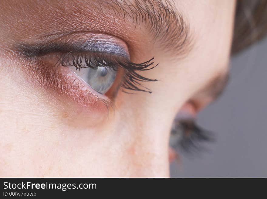 An image of expressive blue woman's eyes. An image of expressive blue woman's eyes