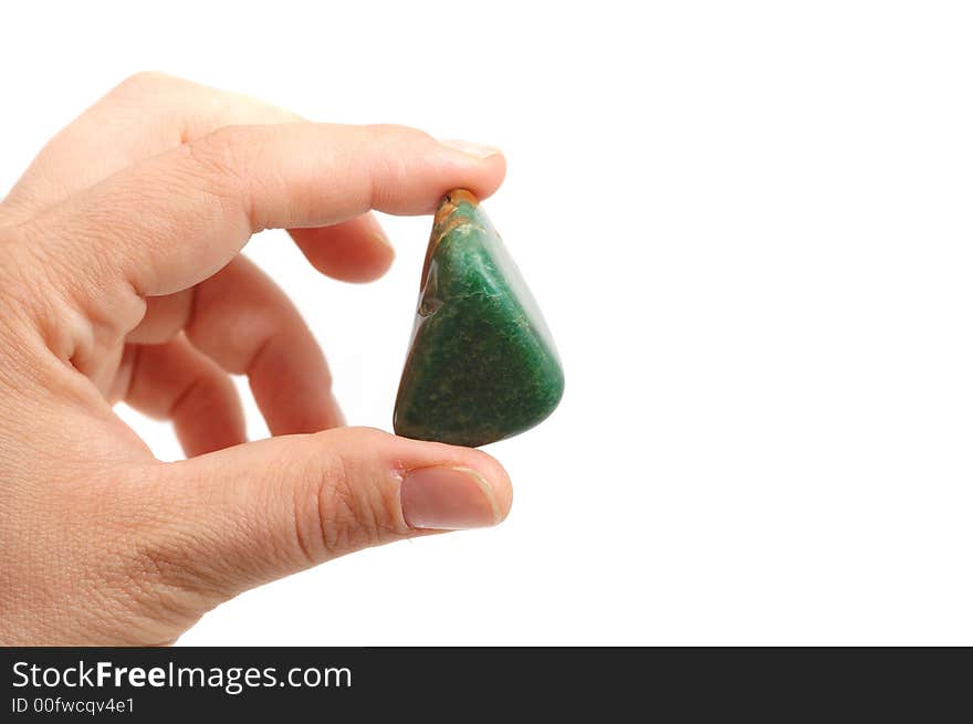 Hand hold lucky green stone