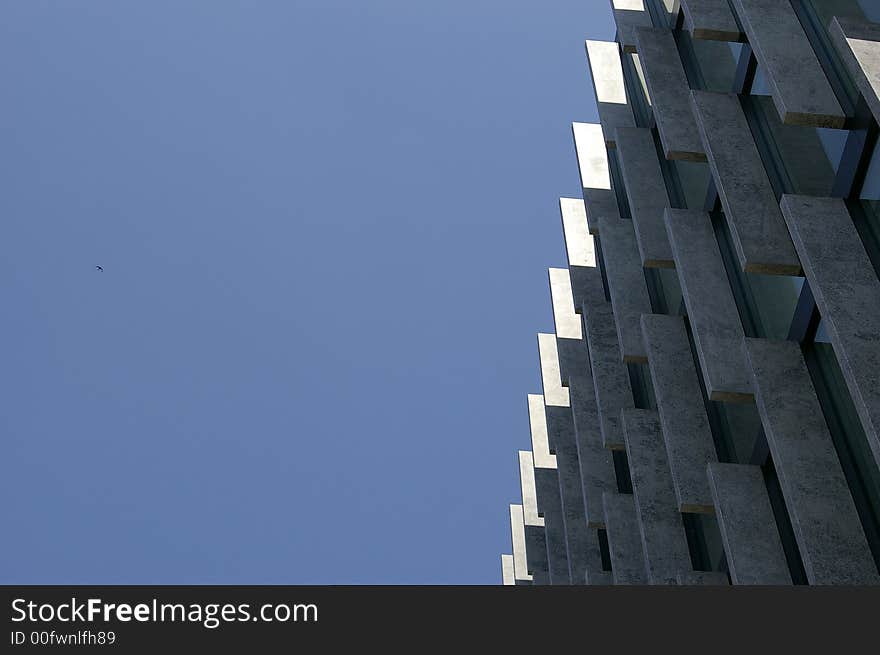 Detail of office building stone facade in the center of Warsaw, Poland