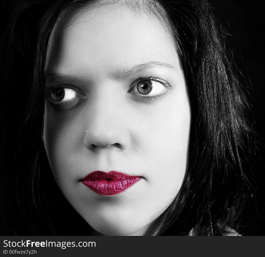 Black&white portrait of young woman with red lips