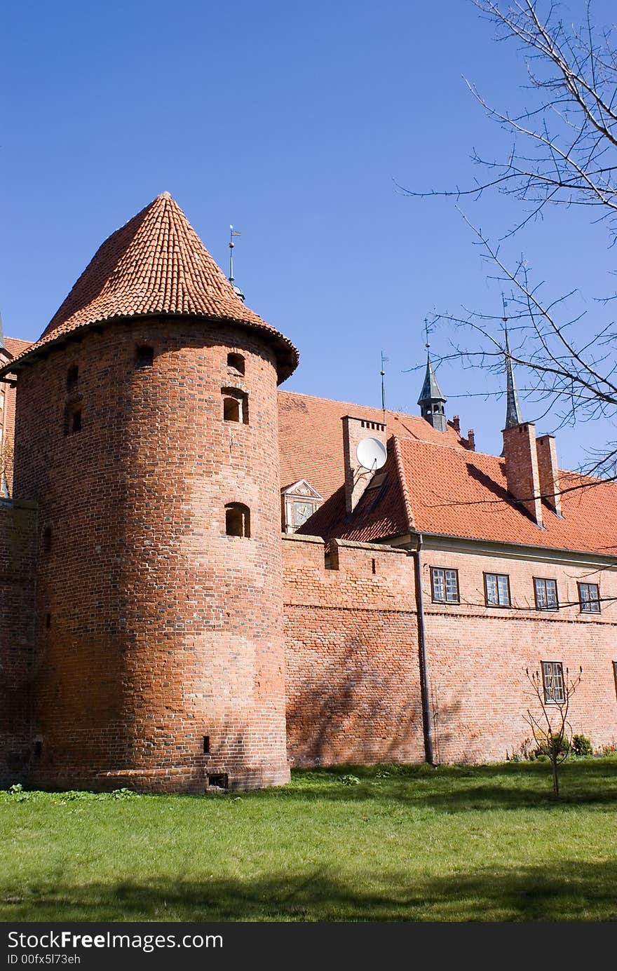 Tower with a fortification, the dark blue sky. Tower with a fortification, the dark blue sky