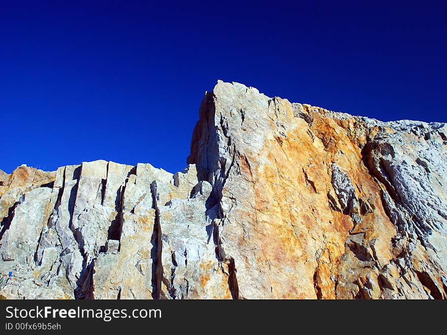 Stone on the blue sky