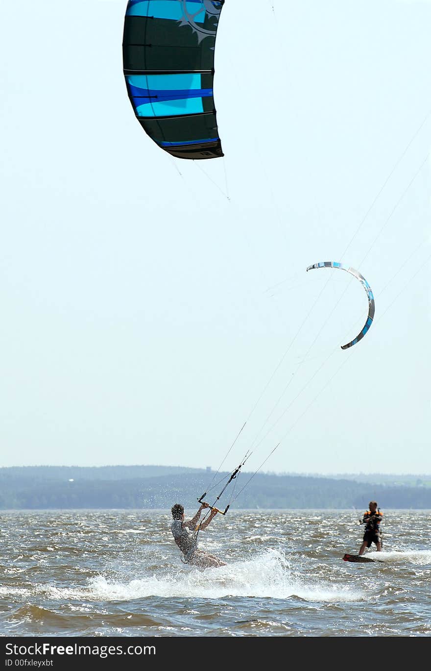 Driving on a board under an air wing on water in the summer. Driving on a board under an air wing on water in the summer