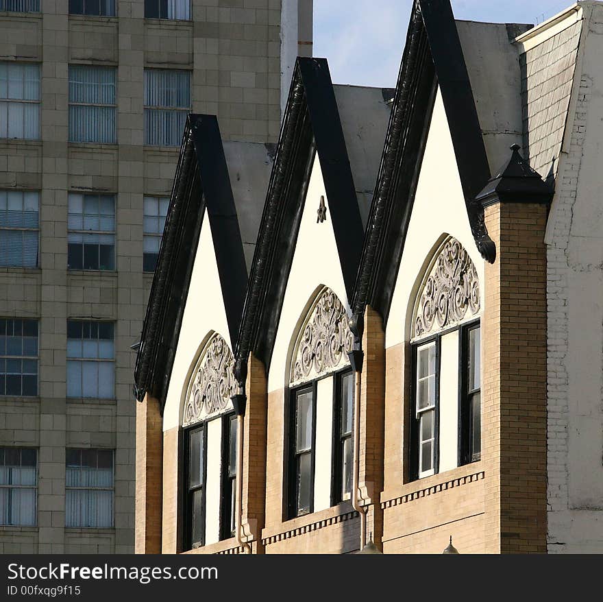 Windows in dormers of an old masonic building. Windows in dormers of an old masonic building