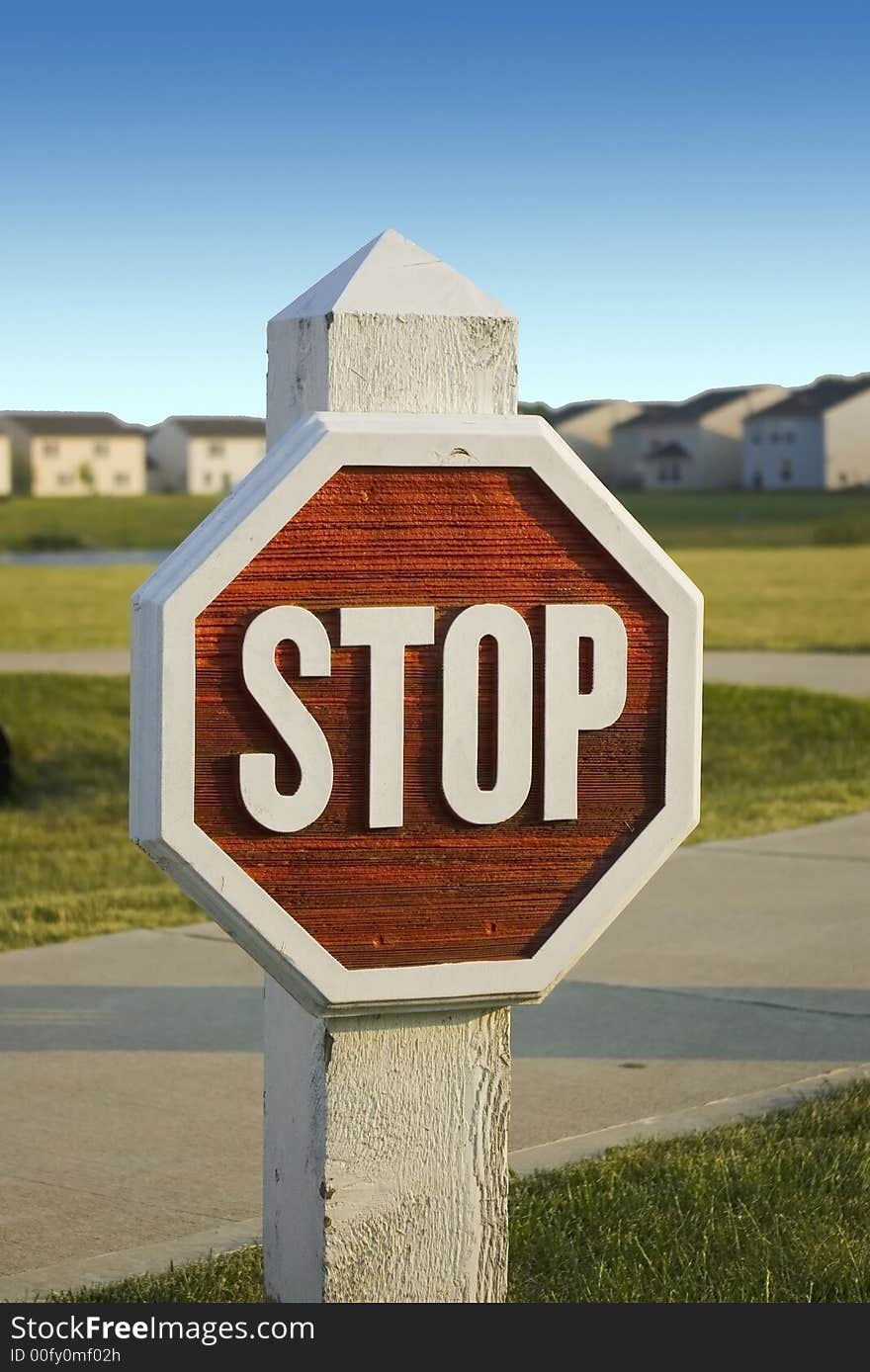 Here is a wooden stop sign in a subdivision. Here is a wooden stop sign in a subdivision.