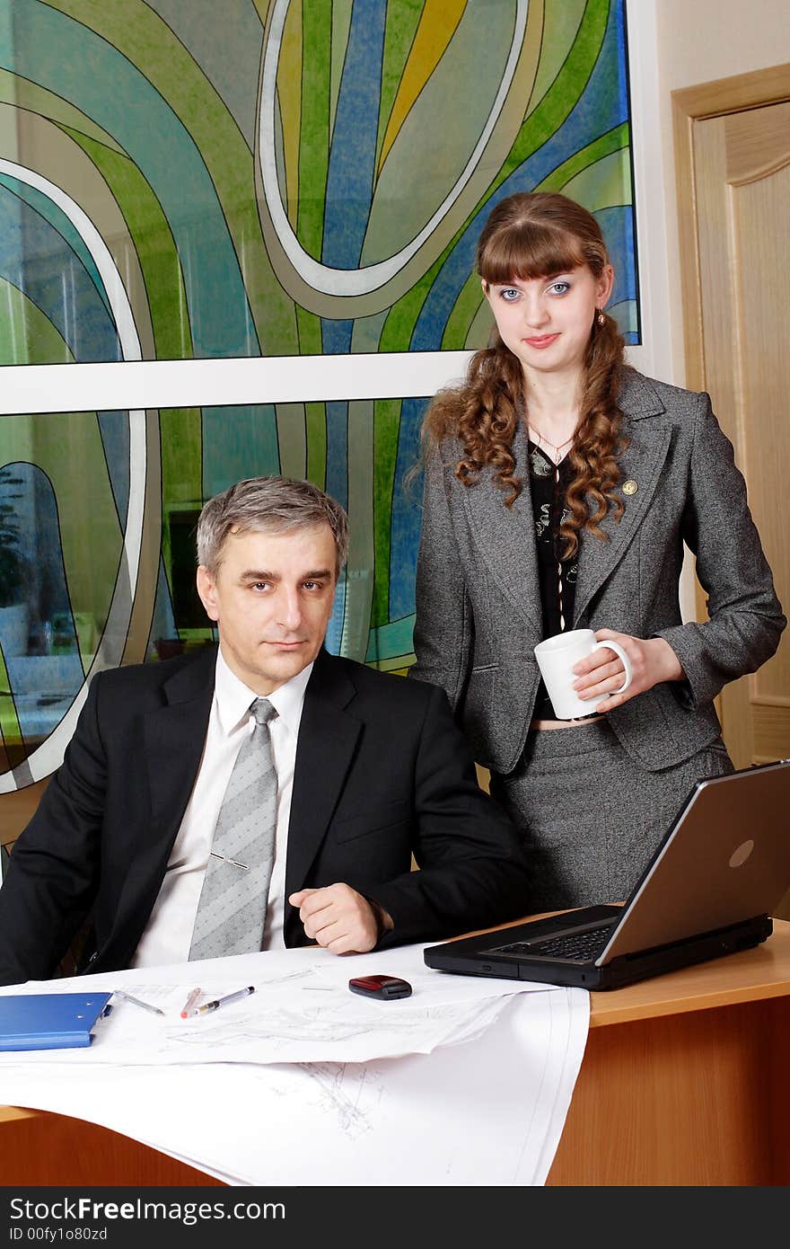 Group of business people working together in the office. Group of business people working together in the office.