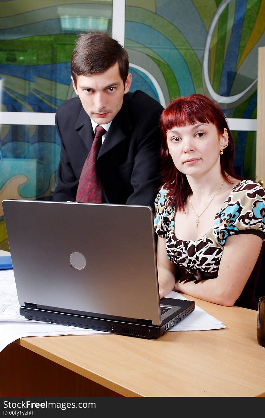 Group of business people working together in the office. Group of business people working together in the office.