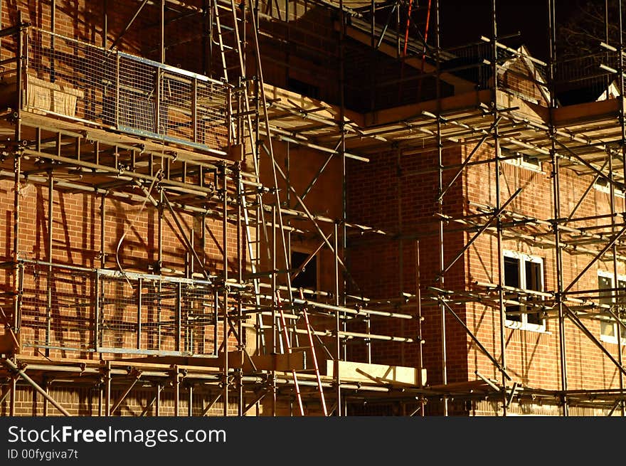 Complex construction site scaffolding at night. Complex construction site scaffolding at night