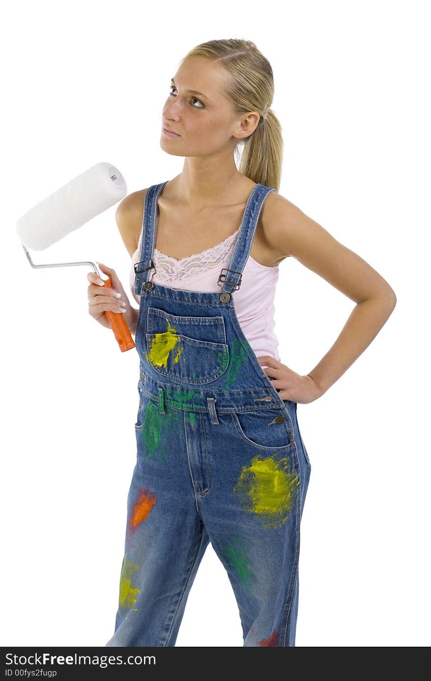 Young blonde wearing dungarees with roll in hand. Isolated on white in studio. Young blonde wearing dungarees with roll in hand. Isolated on white in studio