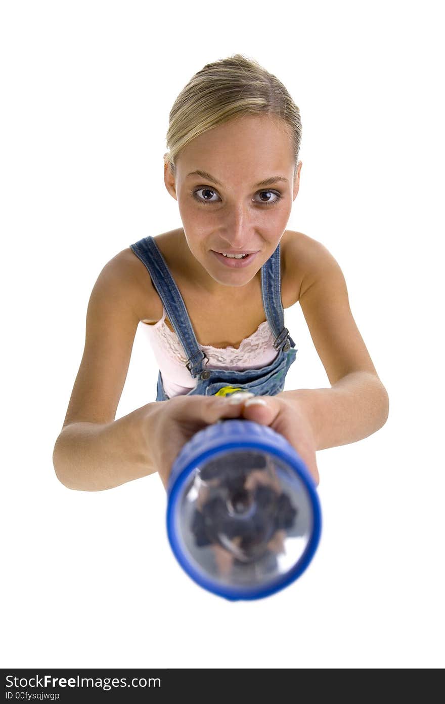 Young smiling blonde wearing dungarees with flash light in hands. Isolated on white in studio. Looking at camera. Whole body, headshot. Young smiling blonde wearing dungarees with flash light in hands. Isolated on white in studio. Looking at camera. Whole body, headshot