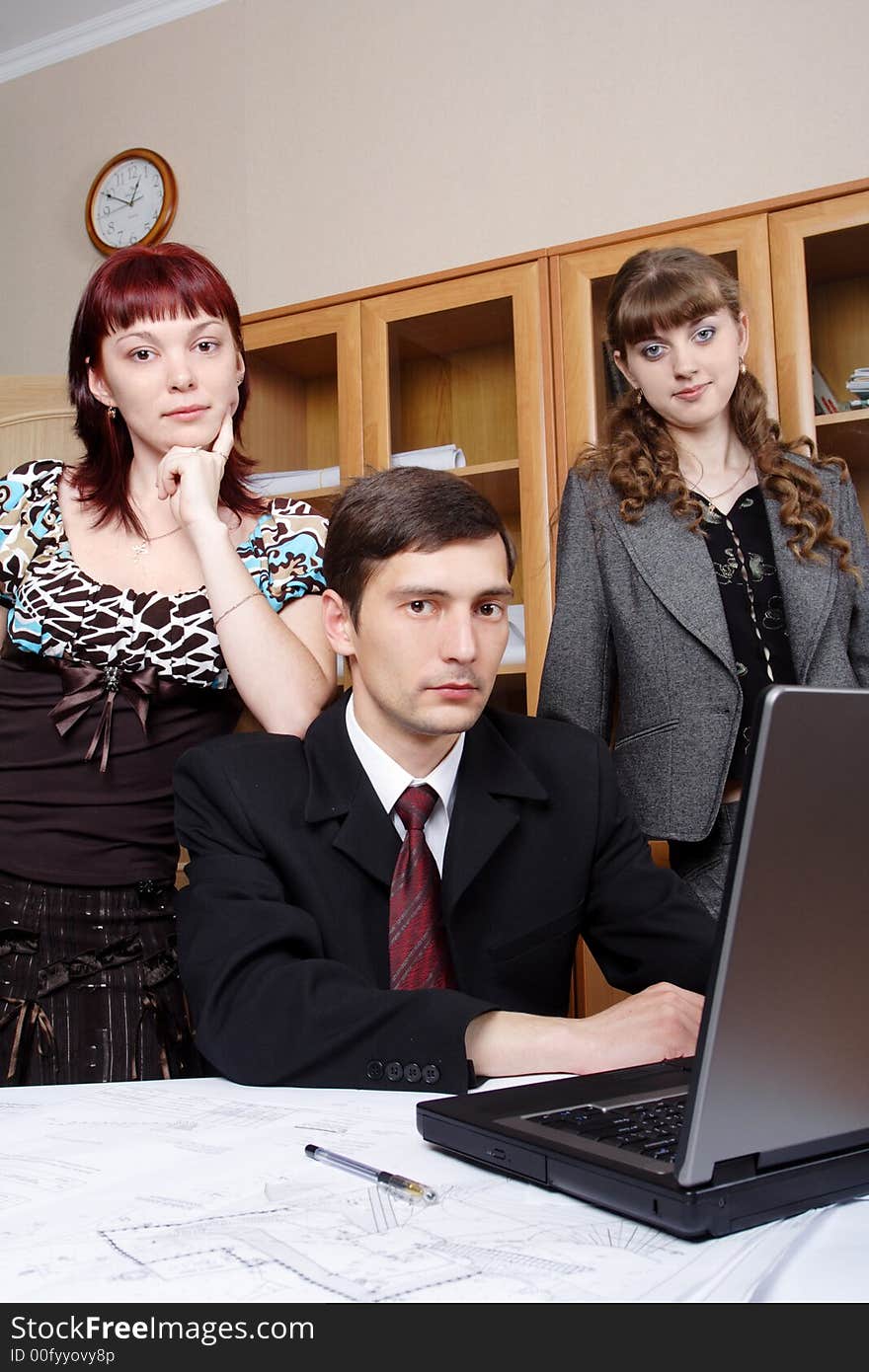 Group of business people working together in the office. Group of business people working together in the office.