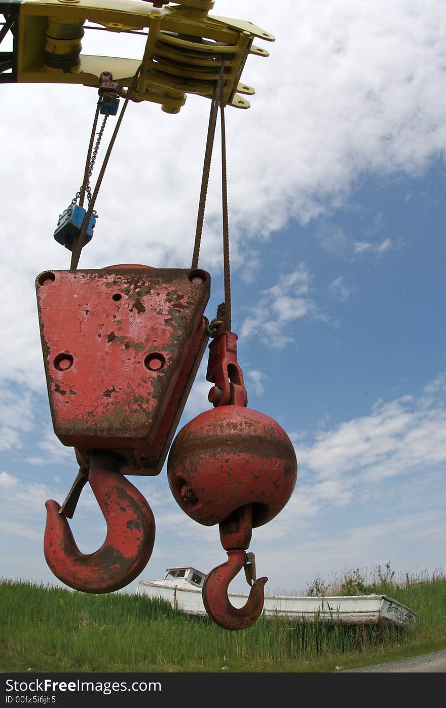 Large crane with two hooks suspended from chain. Large crane with two hooks suspended from chain