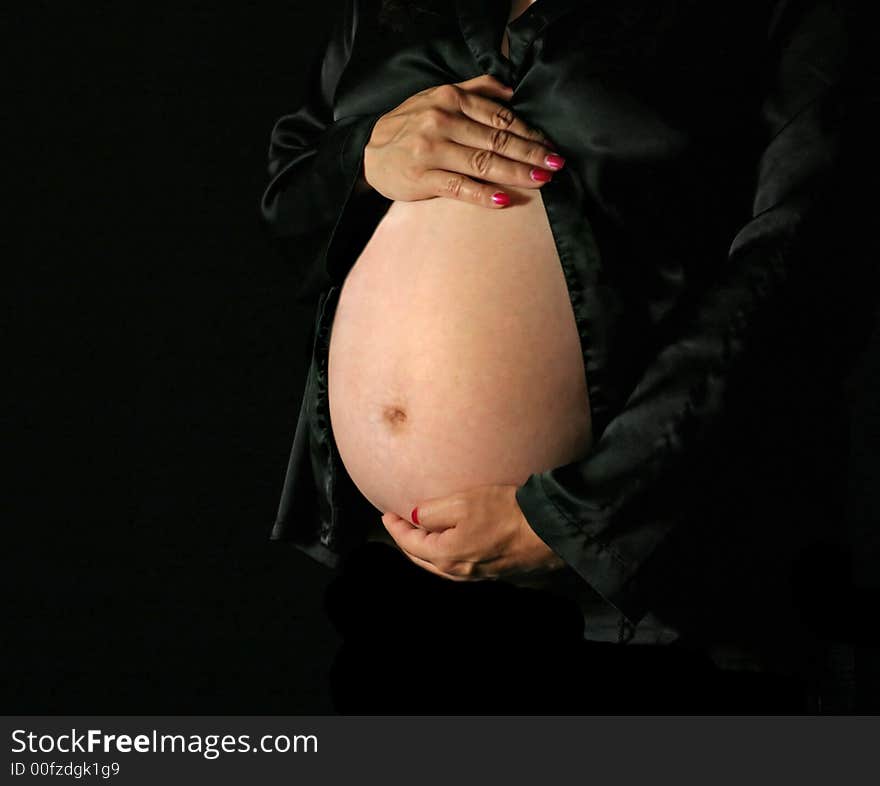 Pregnant Woman holding her Beautiful Belly