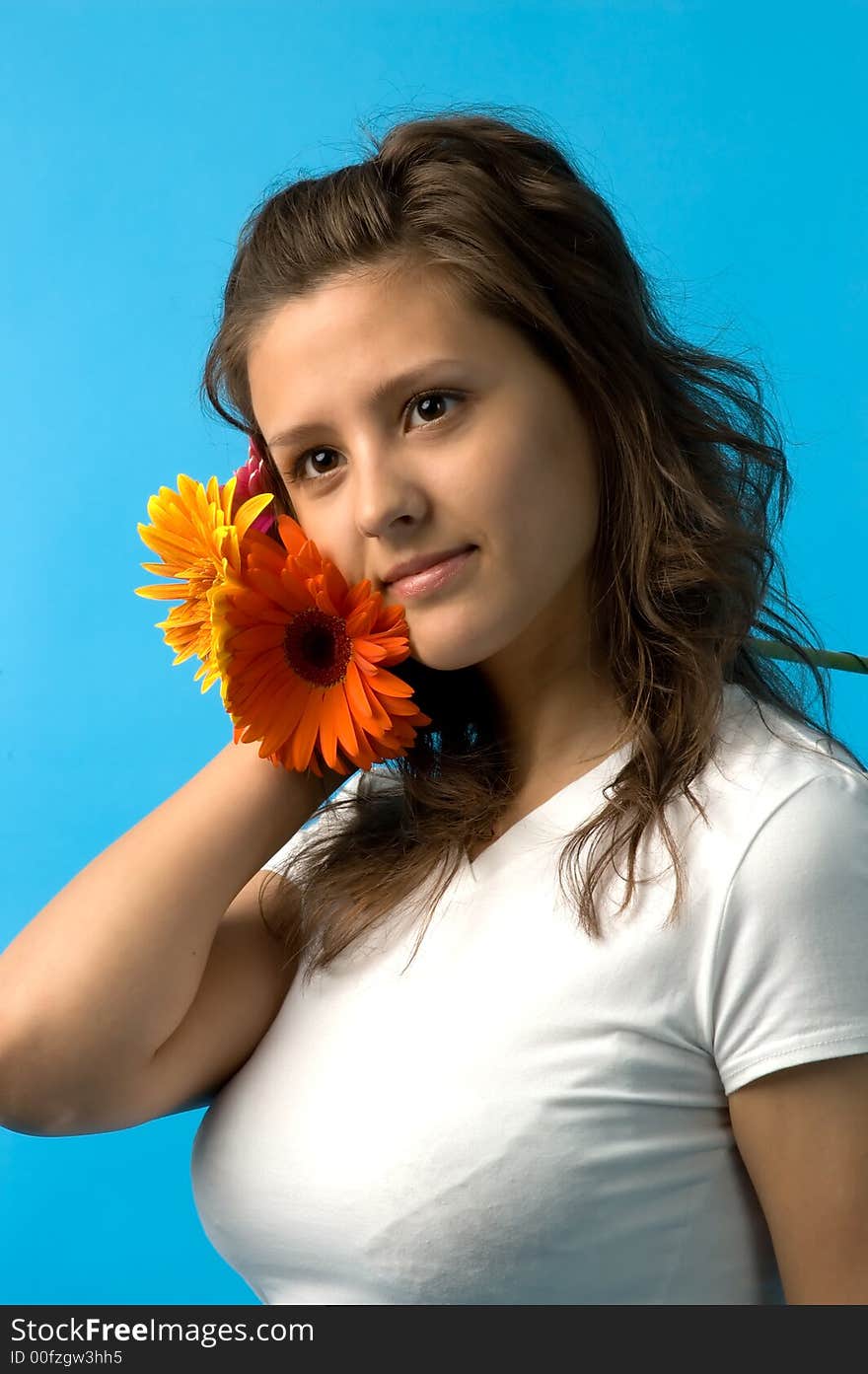 The girl with brown eyes and a bouquet of flowers. The girl with brown eyes and a bouquet of flowers