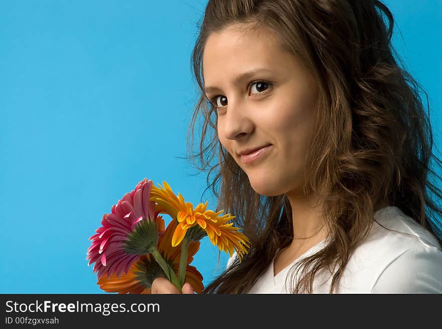 The girl with brown eyes and a bouquet of flowers. The girl with brown eyes and a bouquet of flowers