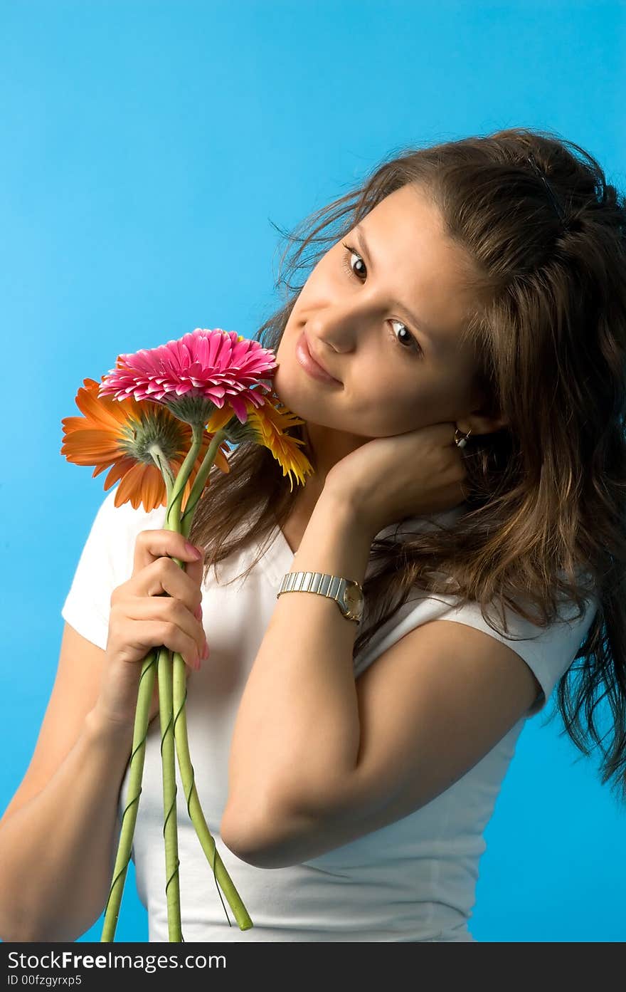 The girl with brown eyes and a bouquet of flowers. The girl with brown eyes and a bouquet of flowers