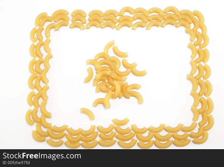 Uncooked little noodle- frame on the white background