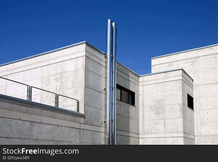 Modern public building against a blue sky