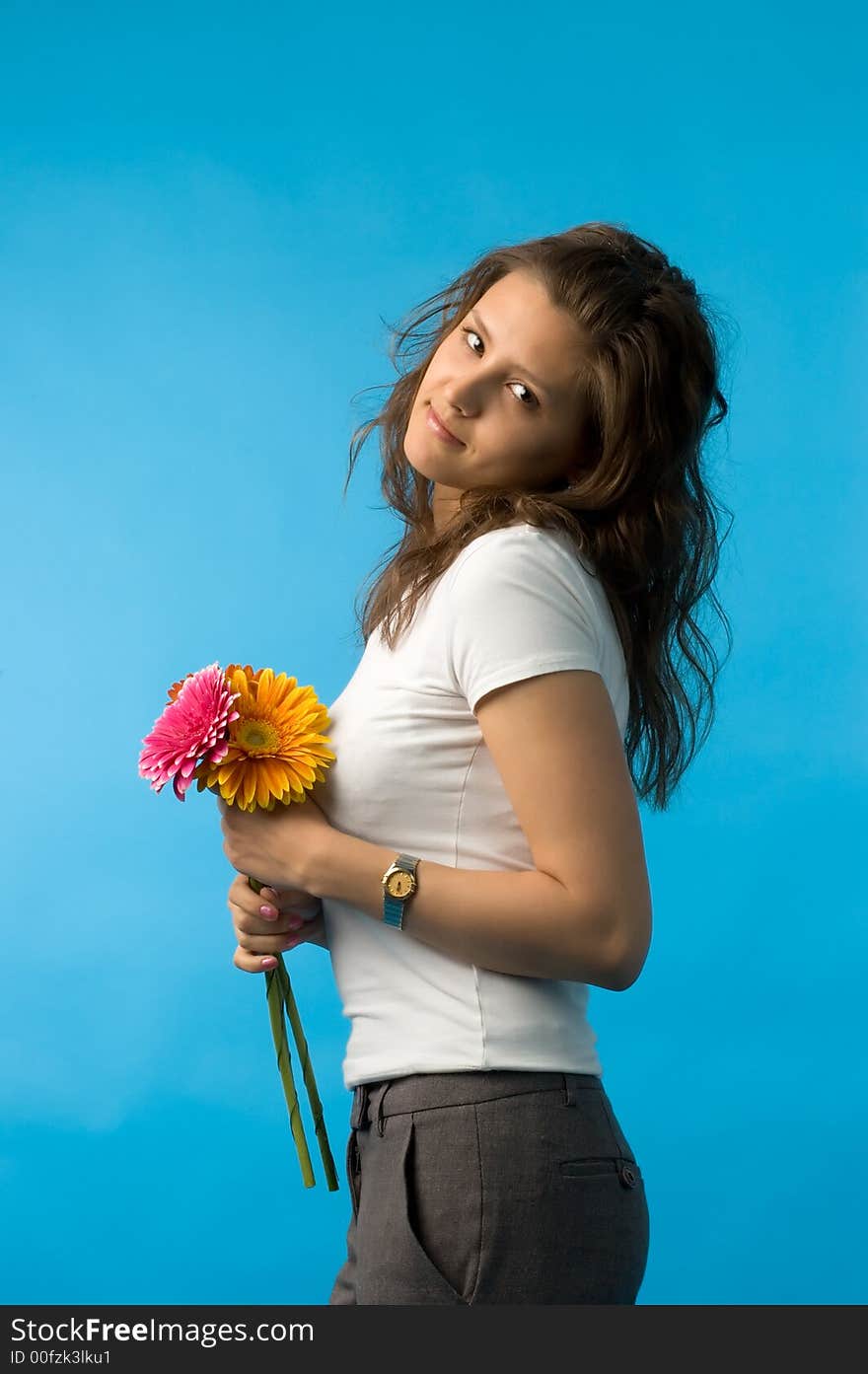 The girl with brown eyes and a bouquet of flowers. The girl with brown eyes and a bouquet of flowers