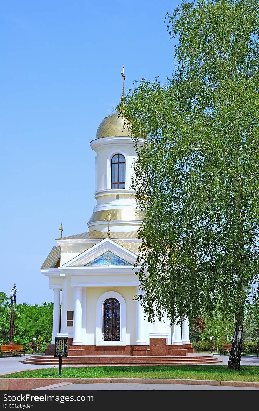 Small church on blue sky background