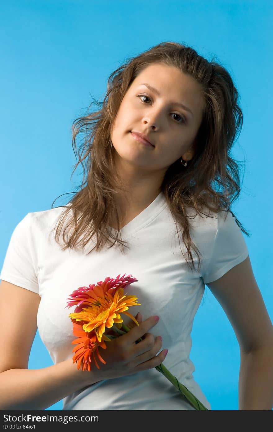 The girl with brown eyes and a bouquet of flowers. The girl with brown eyes and a bouquet of flowers