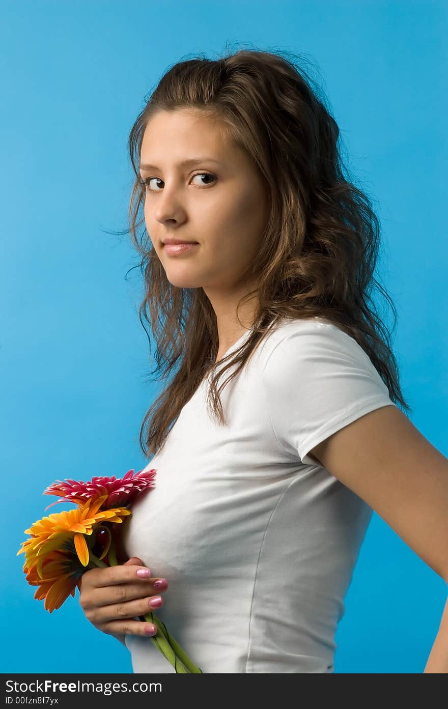 The girl with brown eyes and a bouquet of flowers. The girl with brown eyes and a bouquet of flowers