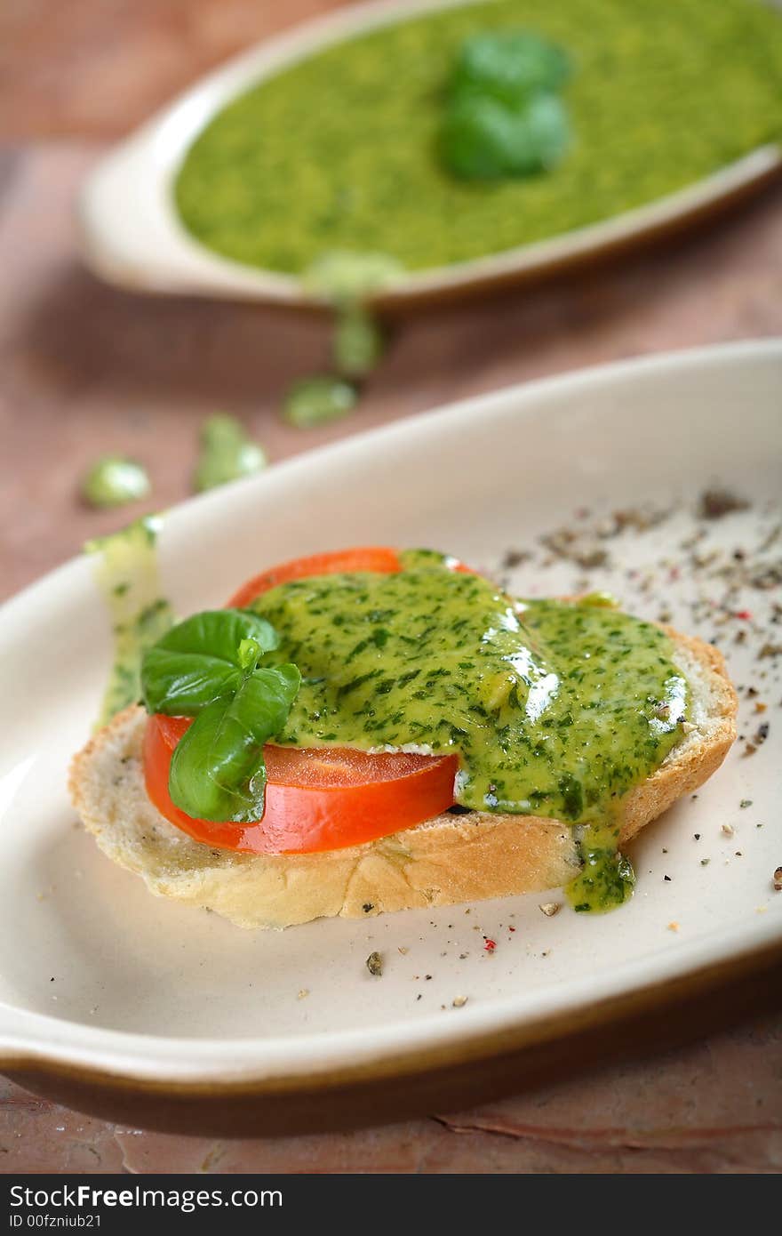 Tasty bread with tomato and basil dressing. Tasty bread with tomato and basil dressing