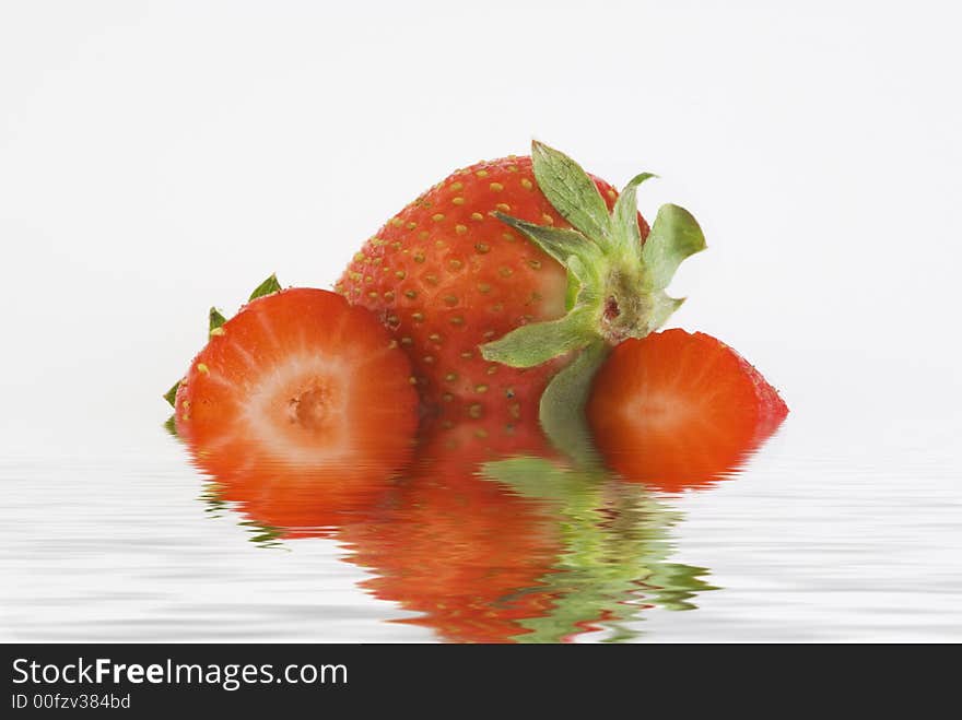 Strawberry isolated white background with reflection in the water. Strawberry isolated white background with reflection in the water