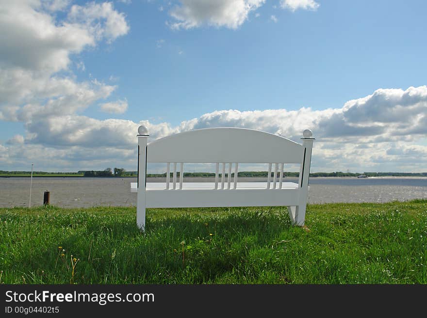 Bench on a dike at a river