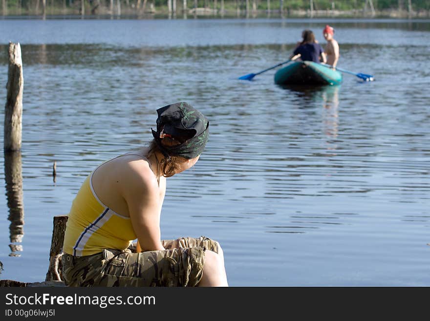 Girl relaxing and watching for the inflatable boat. Girl relaxing and watching for the inflatable boat