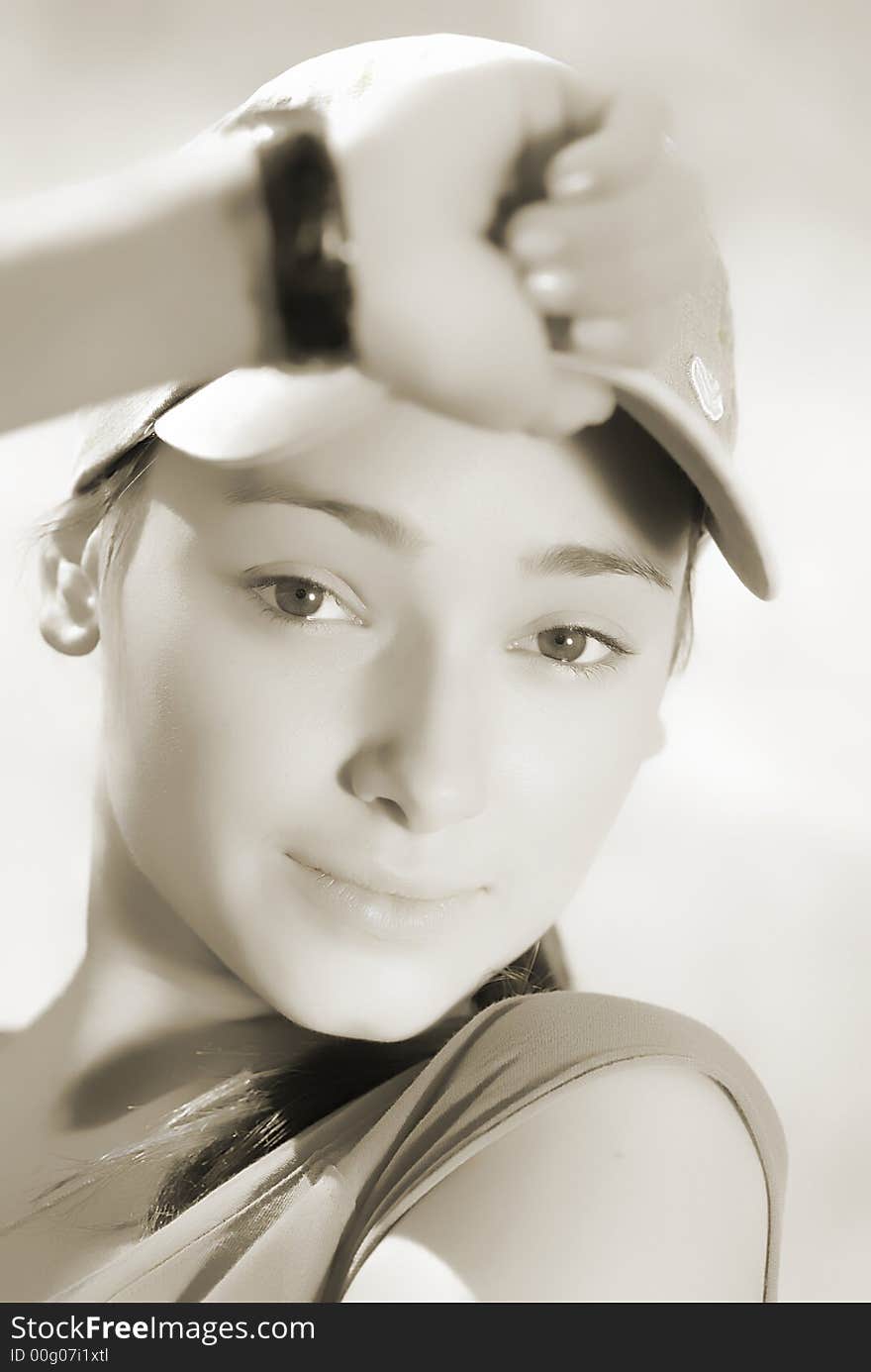 Portrait of  young girl which holds  hand  cap. Portrait of  young girl which holds  hand  cap