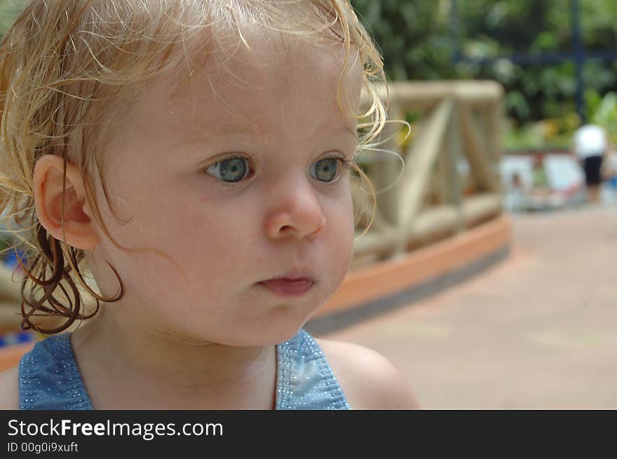 Happy baby girl. in swimming pool