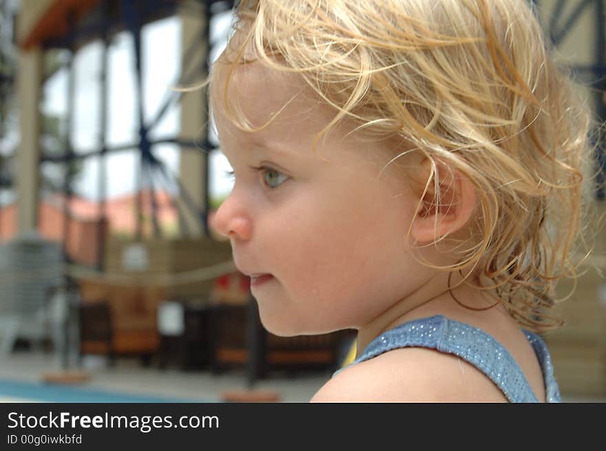 Happy baby girl. in swimming pool