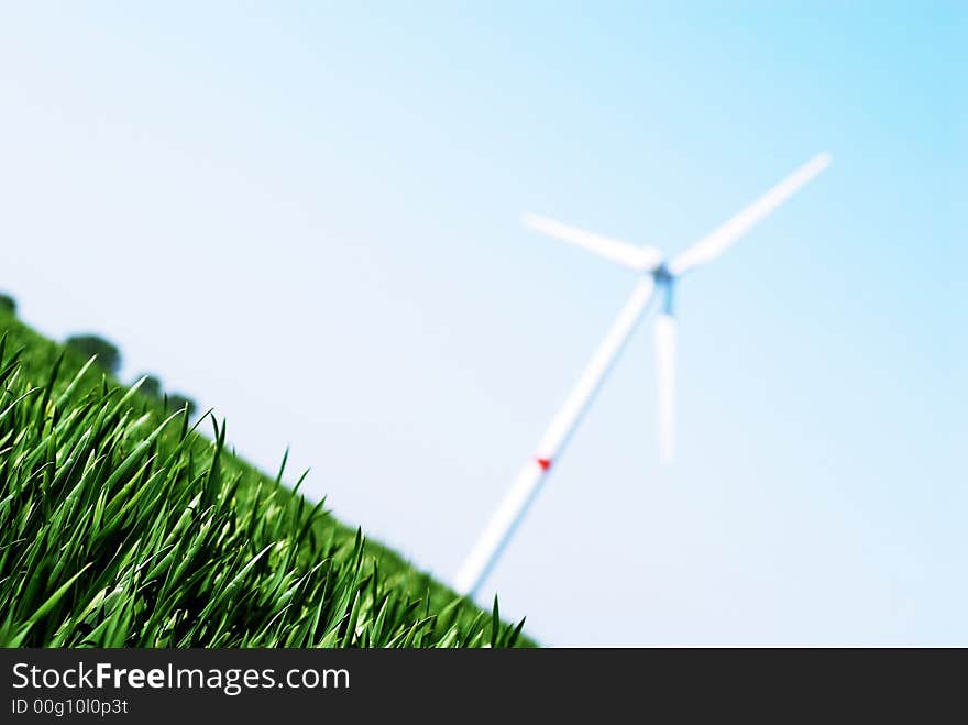 Wind turbine in a green wheat  field