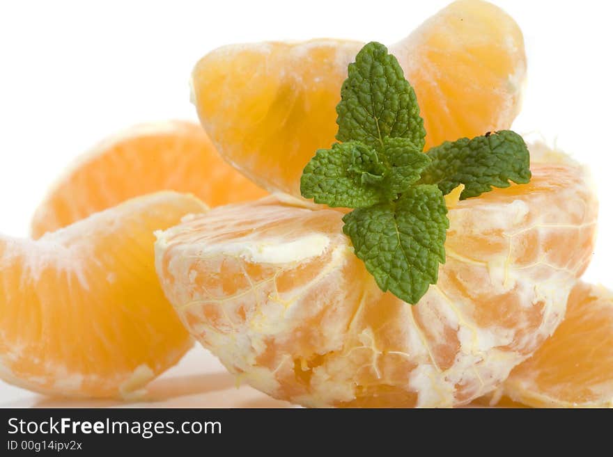 Slices of mandarin fruit and mint leaf. Slices of mandarin fruit and mint leaf