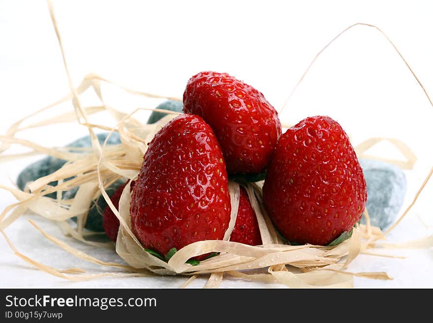 Some strawberry on grey stone with abstract decoration