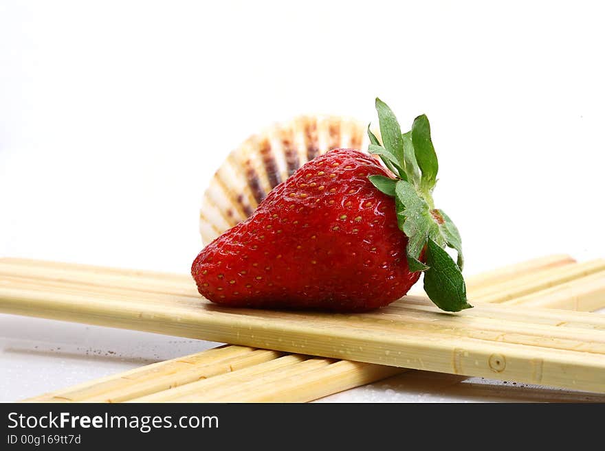 Some strawberry with seashell and abstract decoration