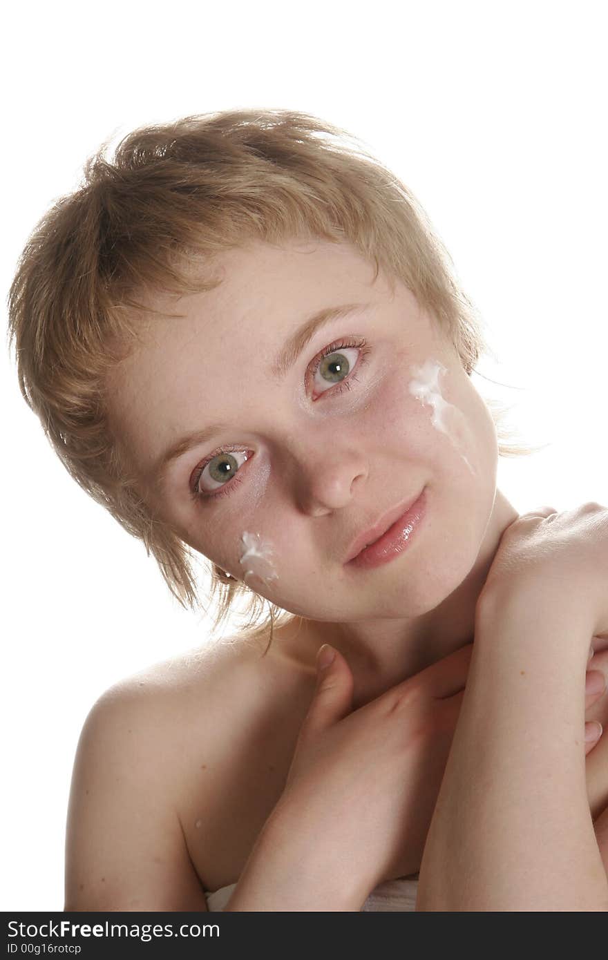 Girl applying creme on her face with hand. Girl applying creme on her face with hand